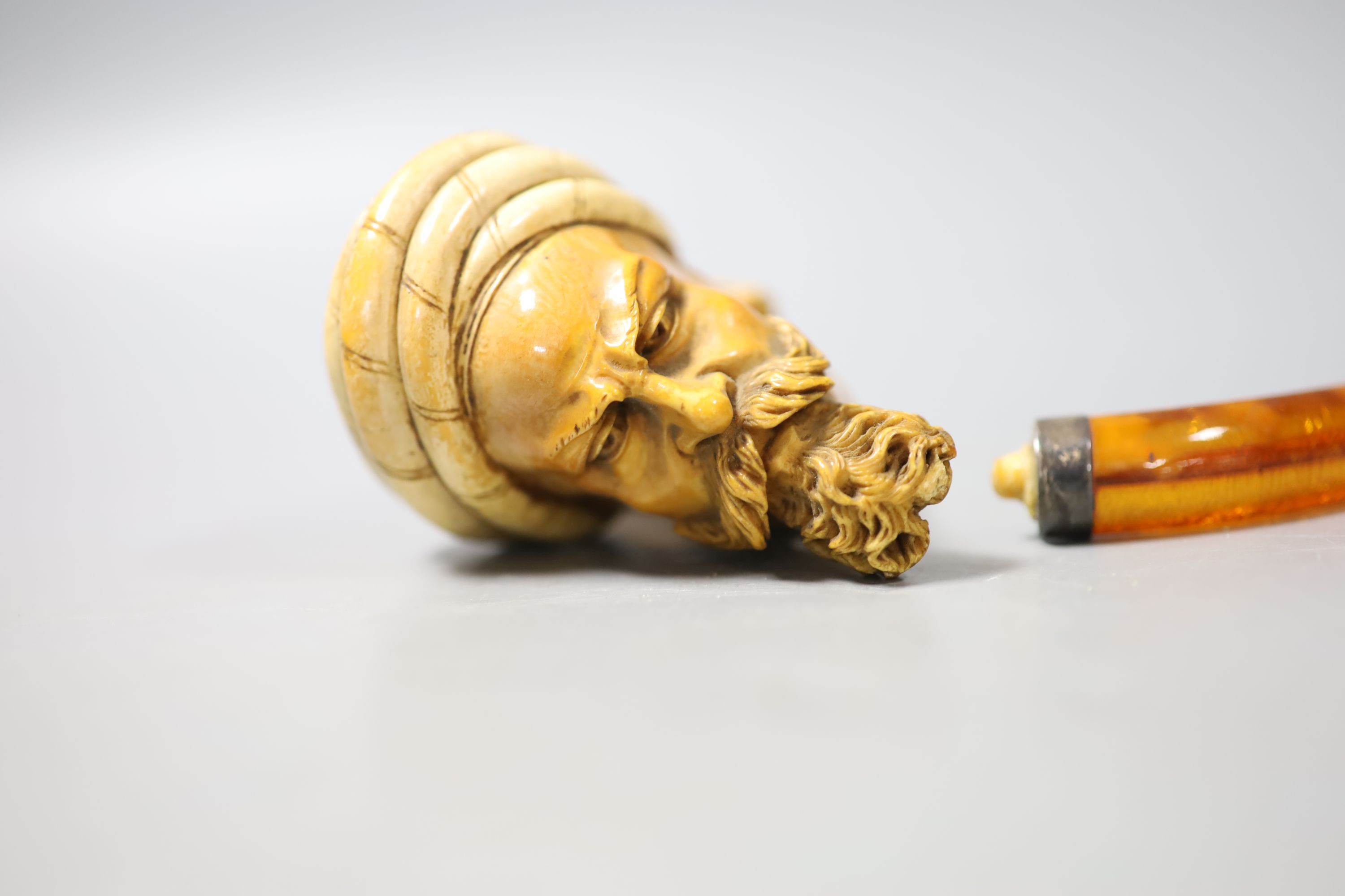 A late 19th century Meerschaum pipe of an Arab gentleman, 14cm